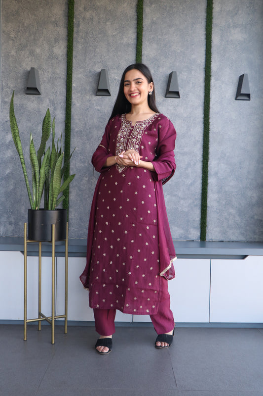 Elegant wine chanderi silk kurta set with beautiful motif, cut dana, sequence, and thread work.