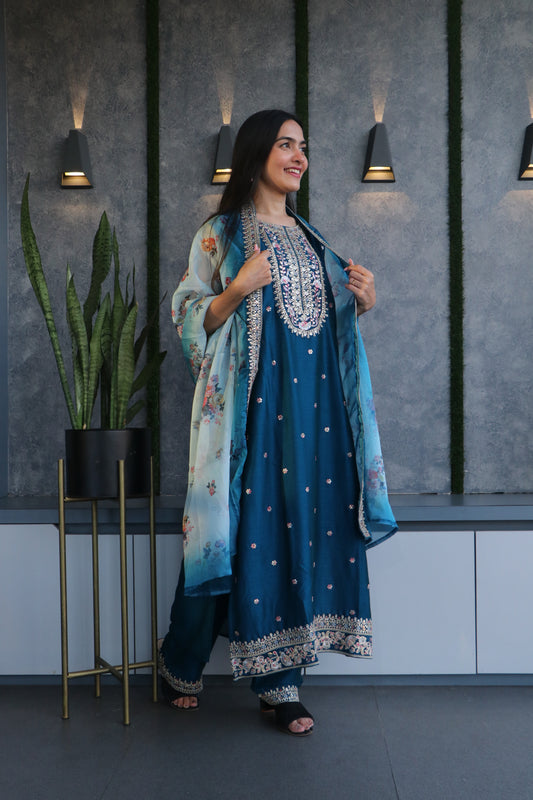 Silk kurta set adorned with pitta work, thread detailing, and a printed organza dupatta for a luxurious look and feel.